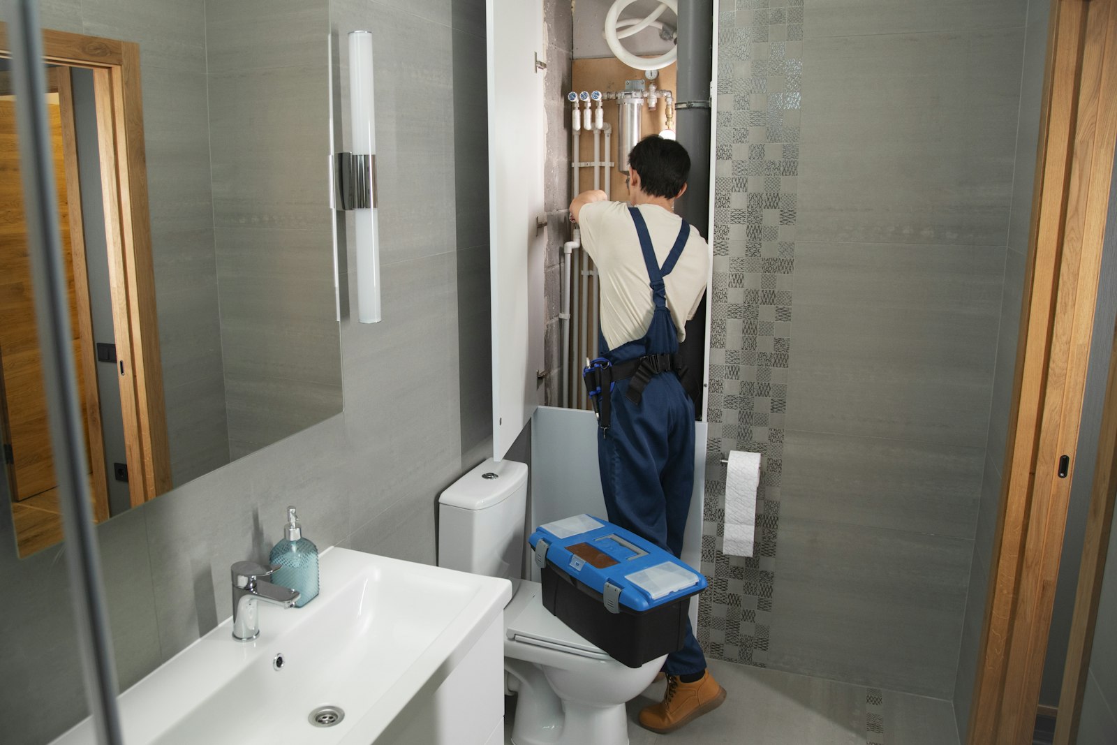 Licensed technician working on residential pipe and pump systems